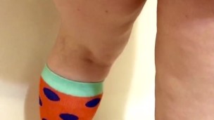 Pissing on Colorful Socks (View from Behind)
