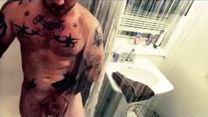 Fit guy taking a shower playing with cock