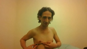 Topless Transgirl Trying to Hold a Pen w/Her Tiny Boobs