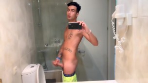 Quick hotel bathroom cumshot into sink in swim trunks while friend is gone