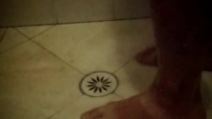 Soapy shower feet and rubbing one down - peephole view