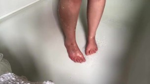 Sarah Feet in shower. Rubbing soap on feet. 