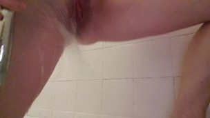 Teen girl legs and pussy wide open pissing in the shower 