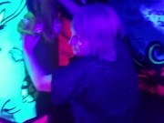 Sexy chick dancing, booty poppin in black light room.