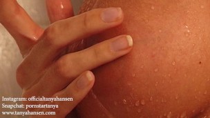 This horny girl plays with herself in the shower ...