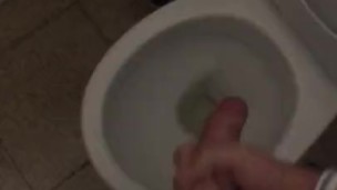 Jerking off in a public toilet. Almost caught by the cleaner!
