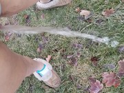Girl Standing Pee Outside In Grass