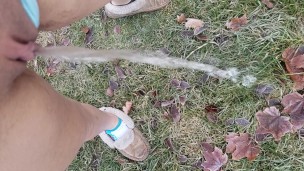Girl Standing Pee Outside In Grass