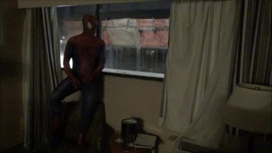 spiderman jerking off watching construction workers from his hotel window