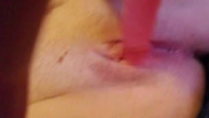 Babe uses pretty pink dildo