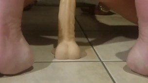 Riding a dildo
