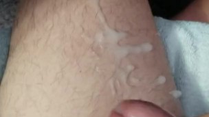 Shooting a big load of cum on my leg.