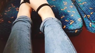  plays with her feet in the train. Public foot fetish