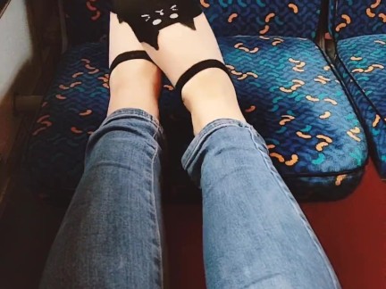  plays with her feet in the train. Public foot fetish