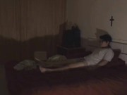 lying on bed alone in empty darkroom