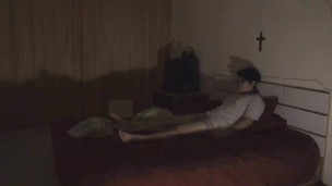 lying on bed alone in empty darkroom