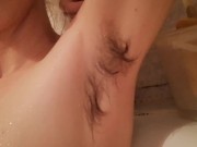 Super hairy girl in the bathtub cleaning herself 