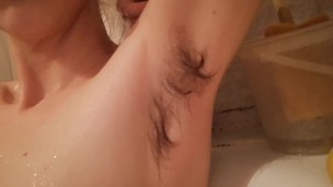 Super hairy girl in the bathtub cleaning herself 