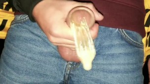 Twink fills cum filled condom even more and SWALLOWS all that cum