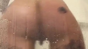 Tattooed hottie all wet in shower 