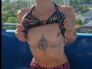 Hot milf Shows off Her Boobs at Public Amusement Park