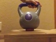 Wife crushes balls with kettle bells