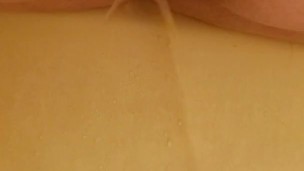 Peeing in the bathtub (back view)