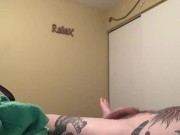 Tattooed guy jacks off to porn