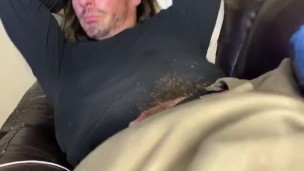 On couch playing with big Irish cock