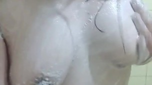 Playing with my boobs while taking a bath