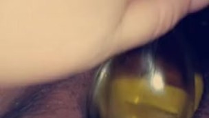 Whore tells herself she's stupid while fucking herself with bottle