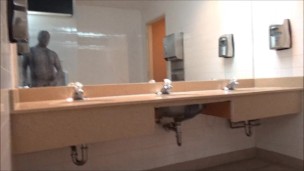 zentai snake showing cock in public bathroom