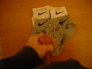 Jerk off and cum over four Nike socks