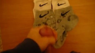Jerk off and cum over four Nike socks