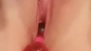 Redhead cumming all over her pink beads and wanting more...........