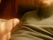 Hot muscular bearded guy jerking his huge dick and moaning