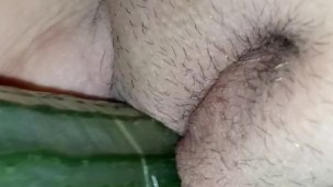 Masturbating with a cucumber