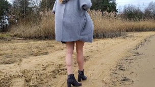 Milf walking on beach near lake and show her underwear