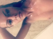 Tanned babe showers 