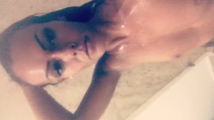 Tanned babe showers 