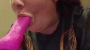 Gagging on a dildo