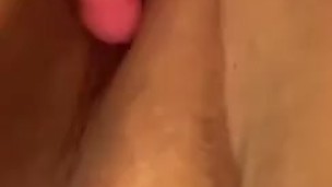Toying her pink pussy