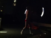 Blond guy spins fire on rooftop in socks and underwear 11/16