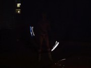 Blond guy spins fire on rooftop in socks and underwear 14/16