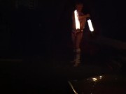 Blond guy spins fire on rooftop in socks and underwear 4/16