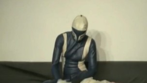 Girl With Transparent Latex Ballhood And Rubber Sheet Makes Breath Play