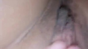 Brunette shows her pussy while masturbating