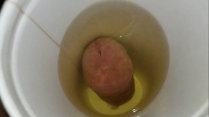 pissing in a cup from the bottom and letting it drip down my balls