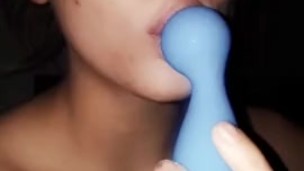 Teen plays with toy in mouth