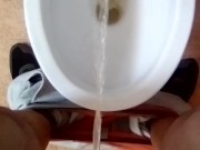Pissing in toilet